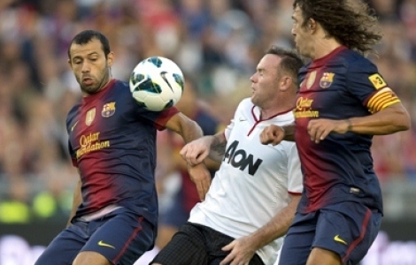 Barcelonas Javier Masherano och Carles Puyol i en närkamp med Wayne Rooney. Foto: Björn Larsson Rosvall, Scanpix